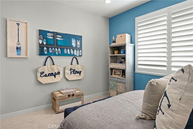 carpeted bedroom featuring multiple windows