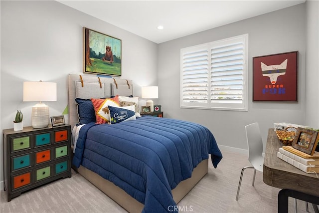 bedroom with light colored carpet