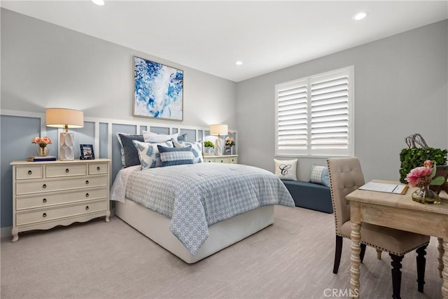 bedroom with light colored carpet