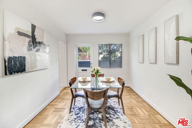 dining area featuring light parquet flooring