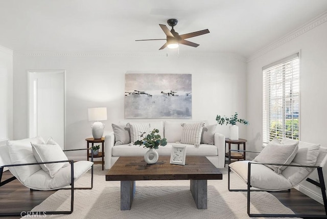 living room with hardwood / wood-style flooring, ceiling fan, and ornamental molding