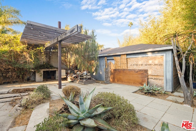 exterior space with a pergola and a patio area