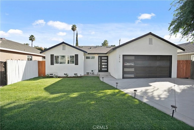 ranch-style home featuring a garage and a front lawn