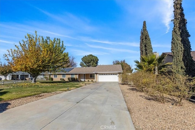 single story home with a front yard and a garage