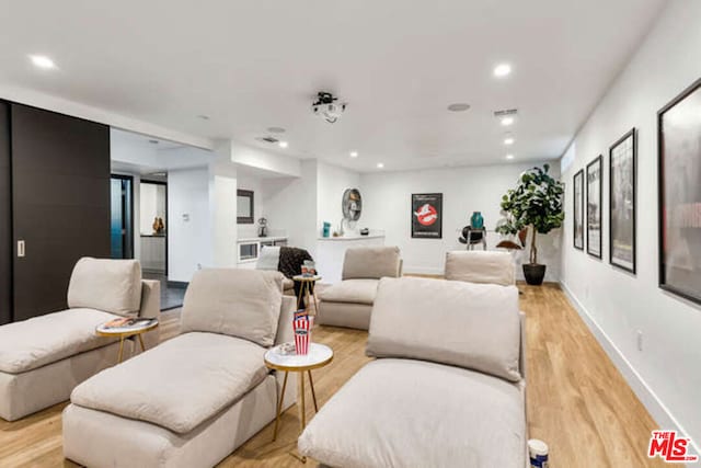 living room with light hardwood / wood-style flooring