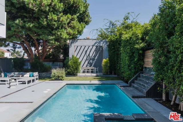 view of swimming pool featuring a patio