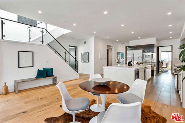 dining area featuring light wood-type flooring