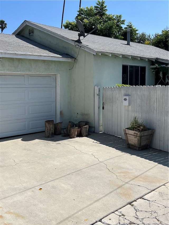 view of side of property with a garage