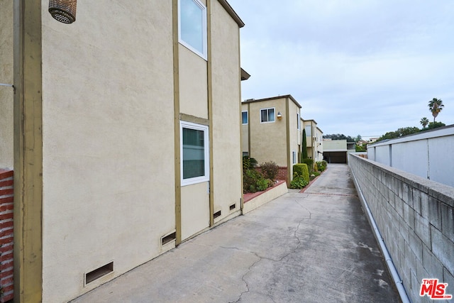 view of property exterior featuring a patio area