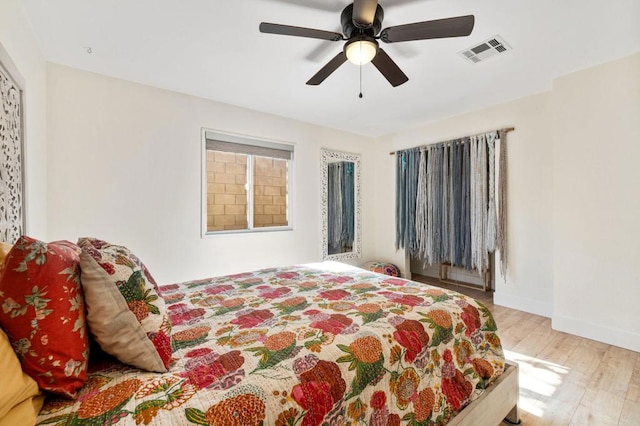 bedroom featuring ceiling fan and light hardwood / wood-style flooring