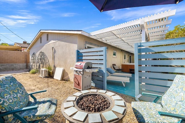 view of patio featuring grilling area, an outdoor fire pit, and a pergola