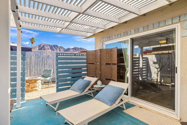 view of patio / terrace featuring a pergola and a mountain view