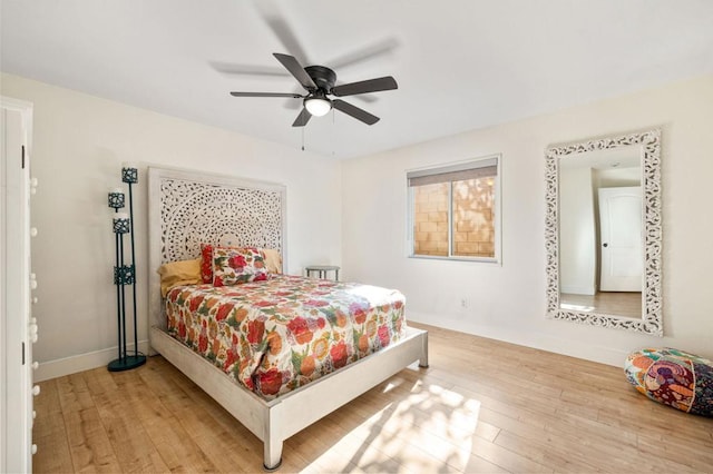 bedroom featuring light wood-type flooring and ceiling fan