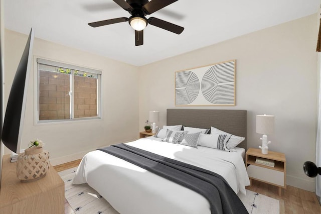 bedroom featuring light wood-type flooring and ceiling fan