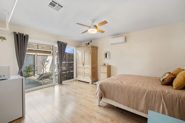 bedroom with multiple windows, an AC wall unit, access to exterior, and ceiling fan