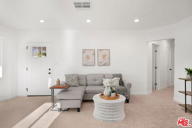 living room featuring light carpet