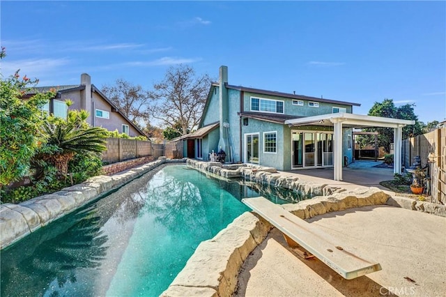 view of swimming pool with a patio