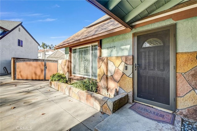 doorway to property with a patio