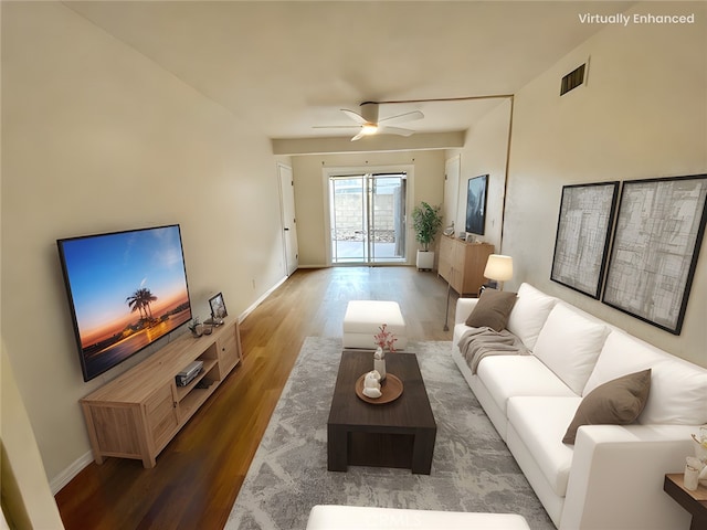 living room with hardwood / wood-style flooring and ceiling fan