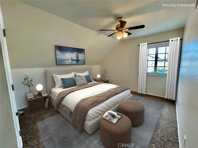 bedroom with vaulted ceiling, carpet flooring, and ceiling fan