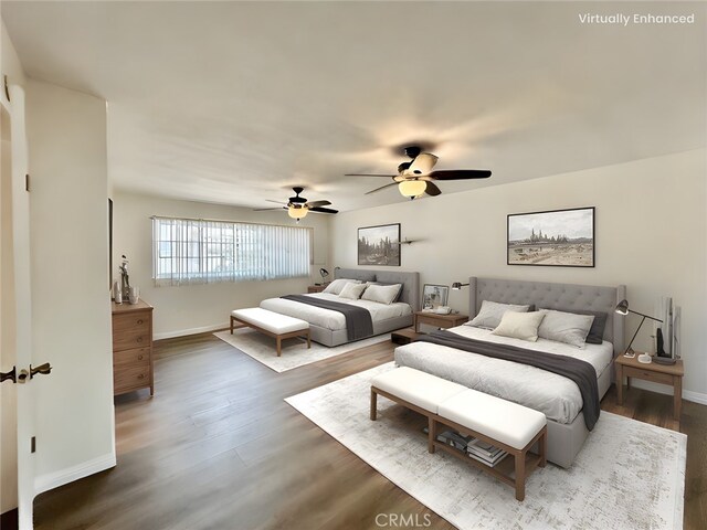 bedroom featuring ceiling fan and dark hardwood / wood-style floors