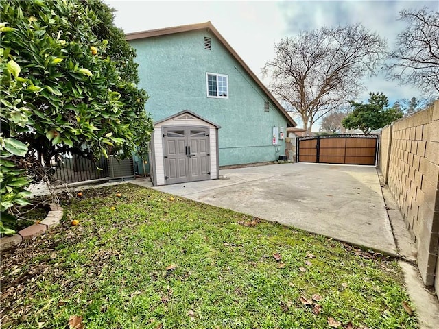 rear view of house with a yard and a patio