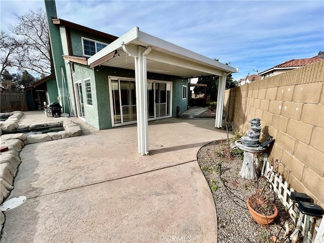 rear view of house featuring a patio