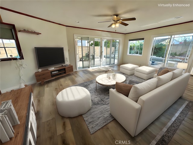 living room featuring crown molding, ceiling fan, and light hardwood / wood-style flooring