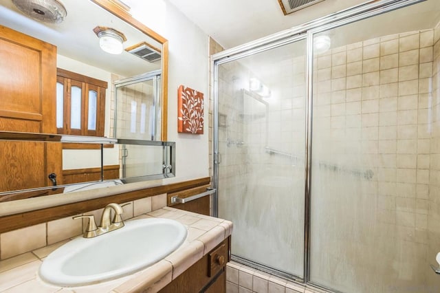 bathroom with vanity and walk in shower