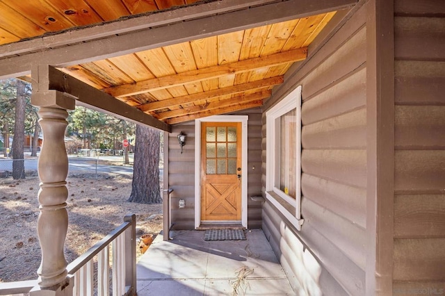 entrance to property featuring a porch