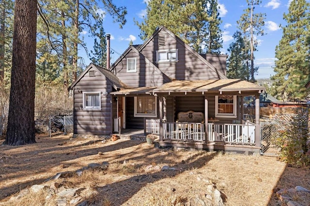 log-style house with a porch