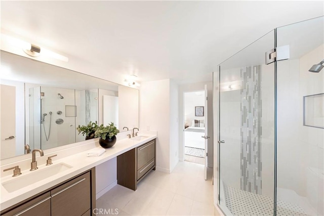 bathroom featuring vanity, tile patterned flooring, and an enclosed shower