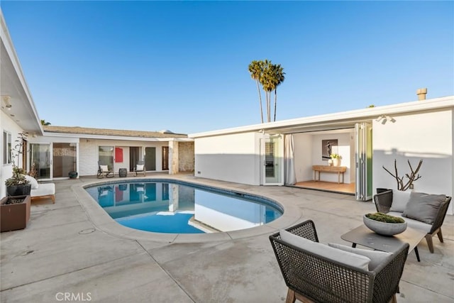 view of pool with a patio