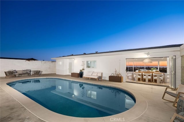 view of swimming pool with a patio area