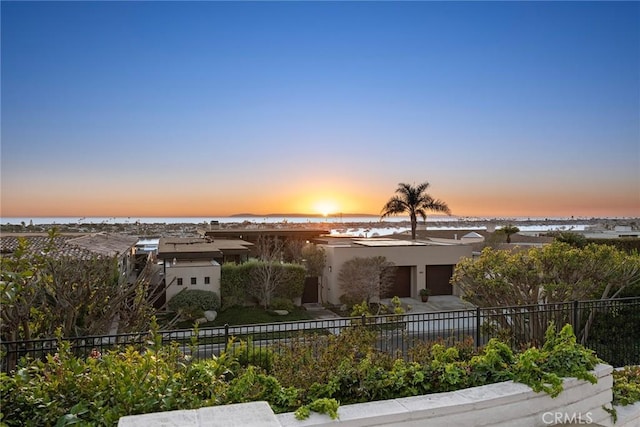 view of front of property with a water view