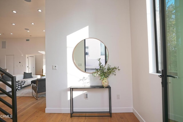 entrance foyer with light hardwood / wood-style flooring and a wealth of natural light