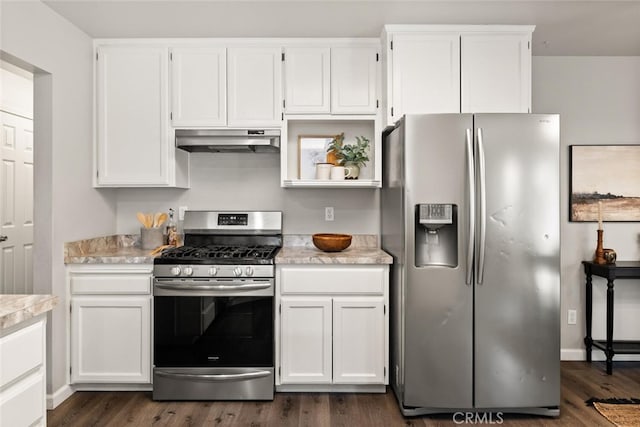 kitchen featuring white cabinets, appliances with stainless steel finishes, and dark wood-type flooring