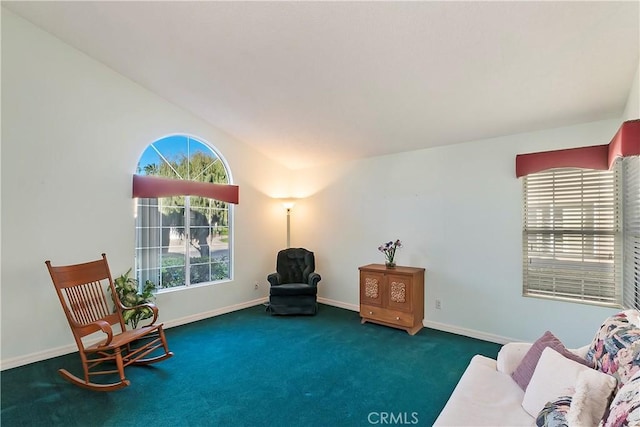 sitting room featuring carpet and baseboards