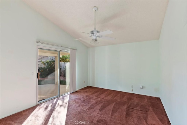 empty room featuring a ceiling fan, carpet flooring, and vaulted ceiling