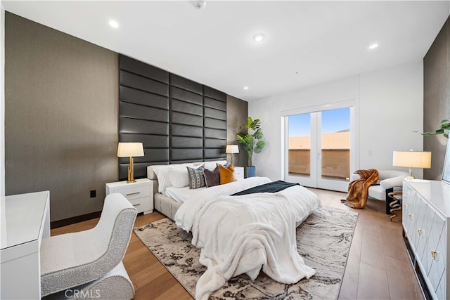 bedroom featuring access to outside and light hardwood / wood-style floors