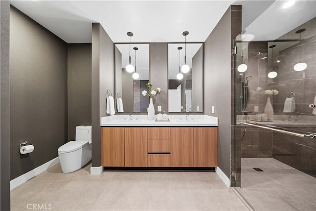 bathroom featuring vanity, toilet, and an enclosed shower