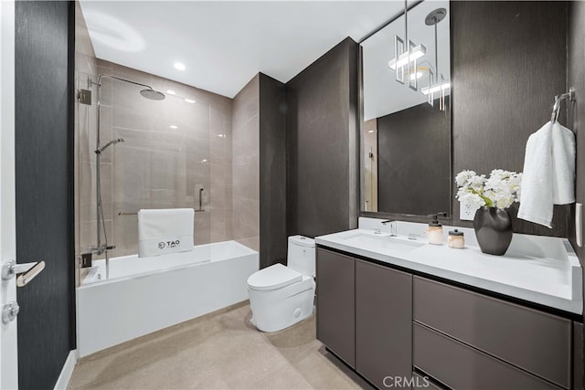 full bathroom featuring vanity, toilet, and tiled shower / bath