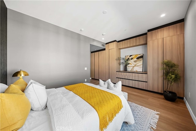 bedroom featuring light wood-type flooring