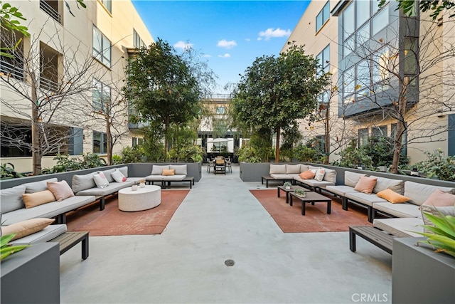 view of community with outdoor lounge area and a patio area