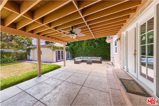 view of patio / terrace featuring outdoor lounge area, ceiling fan, and an outdoor structure