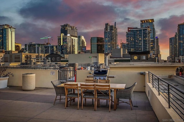 view of patio terrace at dusk