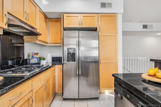 kitchen featuring stainless steel fridge with ice dispenser, light tile patterned floors, light brown cabinets, and gas cooktop