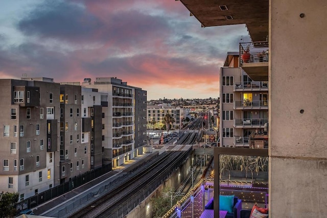 view of balcony at dusk