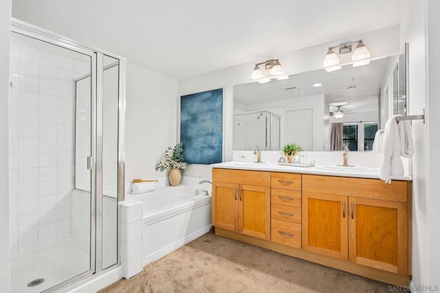 bathroom featuring ceiling fan, vanity, and separate shower and tub