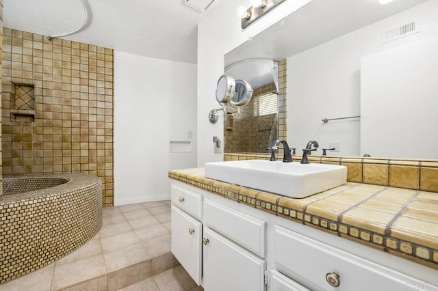 bathroom featuring tile patterned floors and vanity